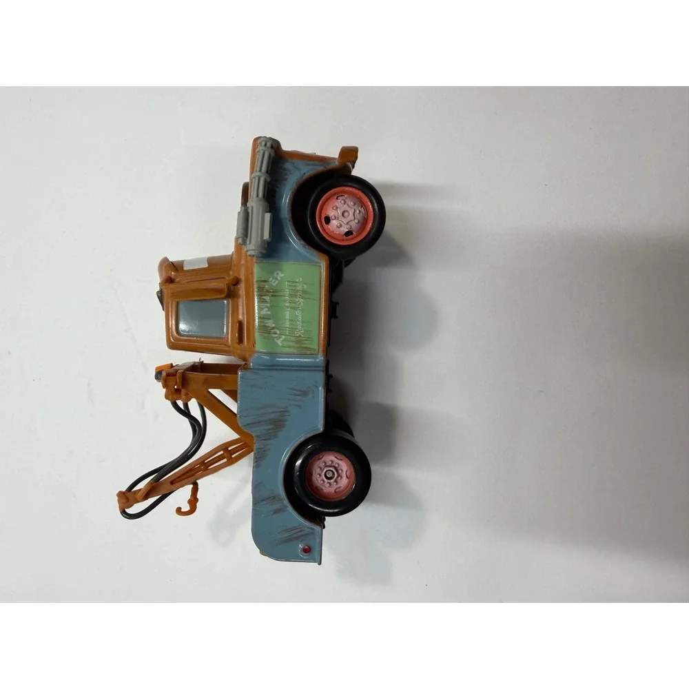 Disney Pixar Cars 2 Spy Mater Tow Truck with Gatling Guns Brown Toy Vehicle